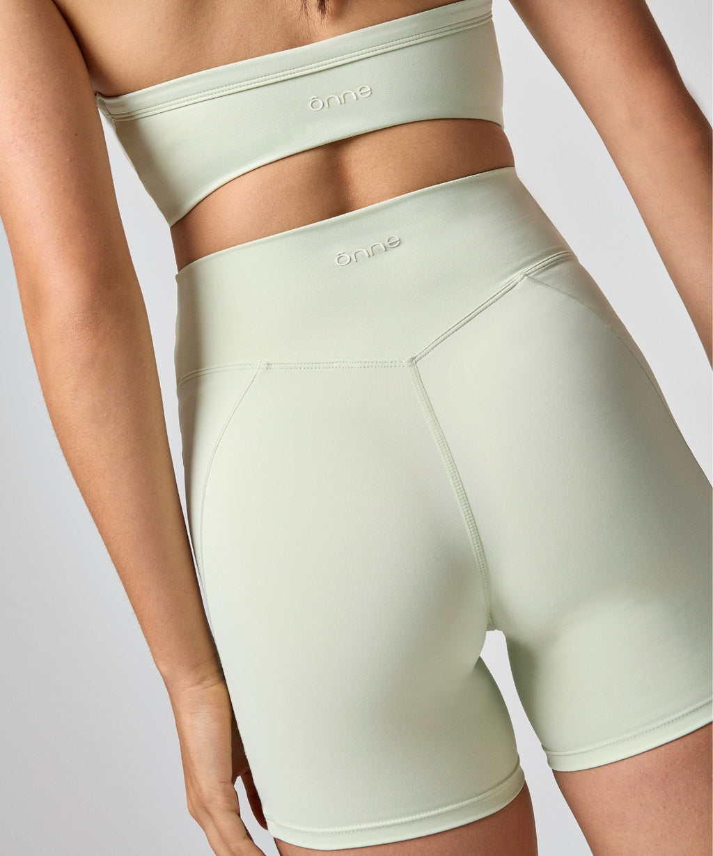 Bali Short in Light fruit green, back view, ÔNNE activewear